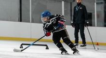 Kid practicing with a coach at Hockey Etcetera