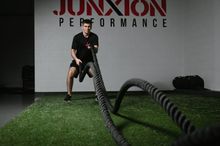 Athlete using the battle ropes at Junxion Performance