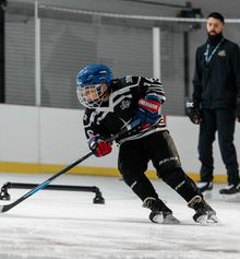 Kid practicing with a coach at Hockey Etcetera