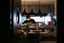 A cook at Bistro 54 preparing food in the kitchen
